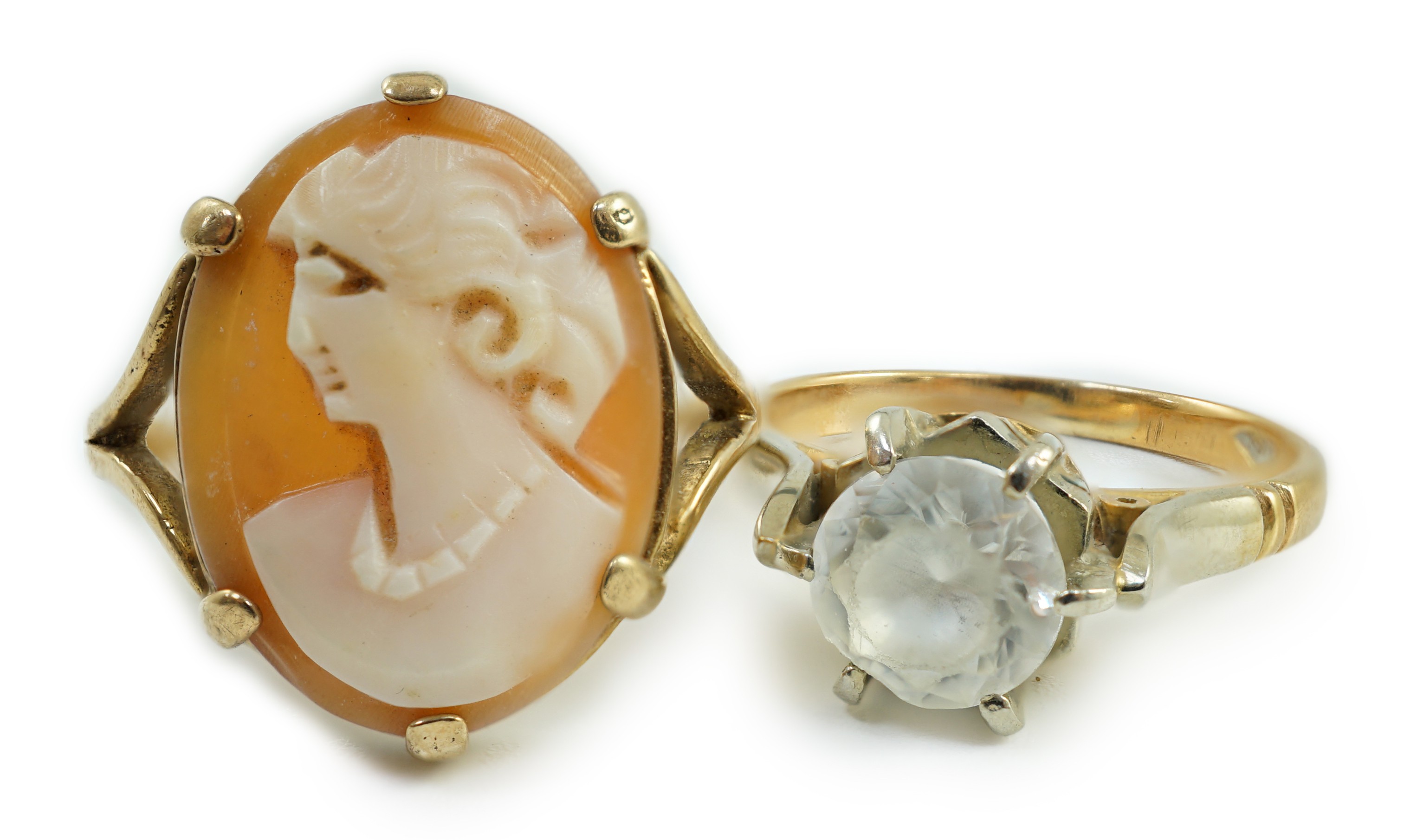 A 750 yellow metal and white zircon ring, gross 4 grams and a yellow metal and cameo shell ring, gross 2.8 grams.